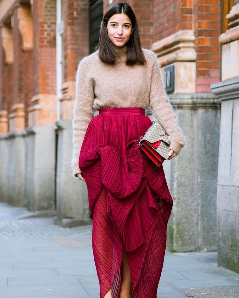 Bettina Looney wearing red skirt from By Rotation